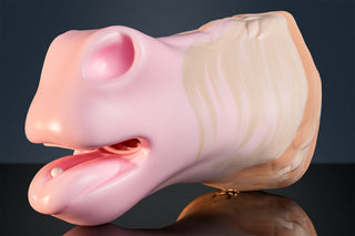 Close-up side view of the Diamond horse equine muzzle toy with open equine mouth shape, soft pink muzzle, cream and gold marble body, glossy silicone finish and reflection on a black studio surface.